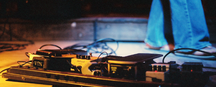 Pedalboard and Guitarist
